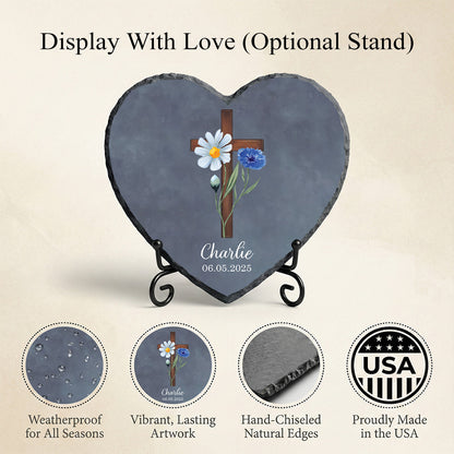 Heart-shaped slate with floral design and cross, displayed on an optional stand, on a beige background.