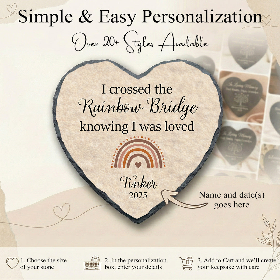 Heart-shaped personalized stone with text and rainbow design on a light background