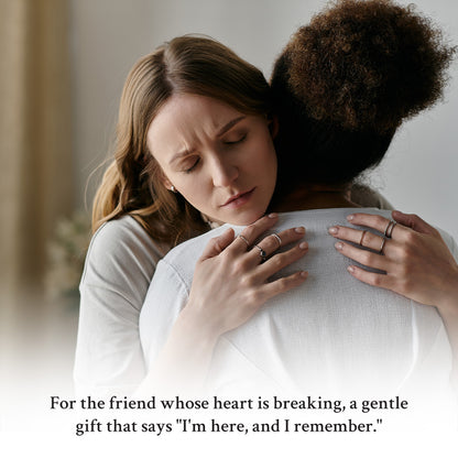 Two women embracing, one comforting the other with a text overlay.