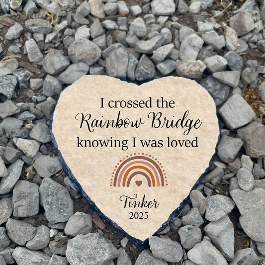 Personalized Rainbow Bridge pet memorial stone on gravel. Customized with name Tinker. Hopeful sympathy gift for loss of pet.