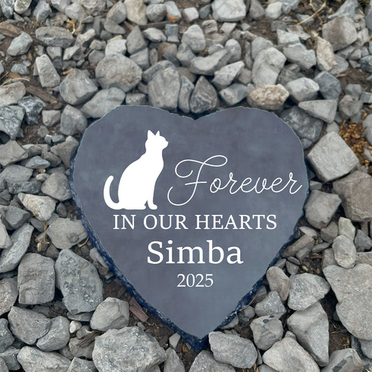 Personalized sitting cat memorial heart stone on gravel. Customized with name Simba. Cat grave marker. Sympathy gift for loss of cat.