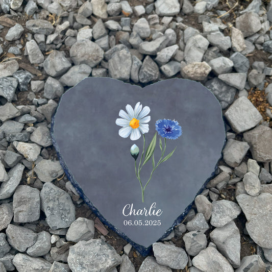 Personalized Forget-Me-Not infant loss memorial stone on mulch. Customized with name Charlie. Hopeful sympathy gift for grieving parents.