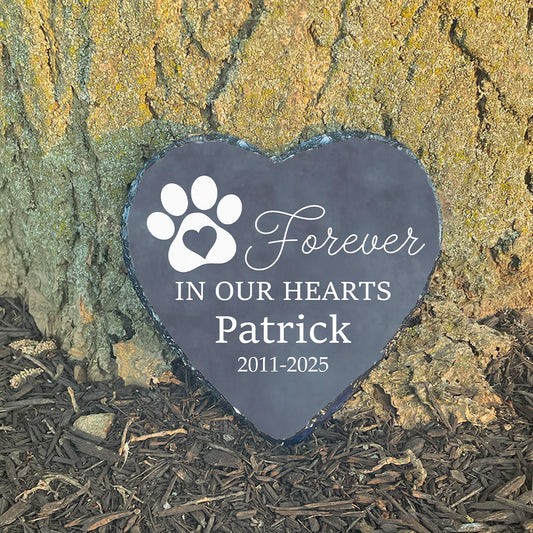 Personalized pet memorial heart stone on gravel. Customized with name Patrick. Dog grave marker. Sympathy gift for loss of pet.