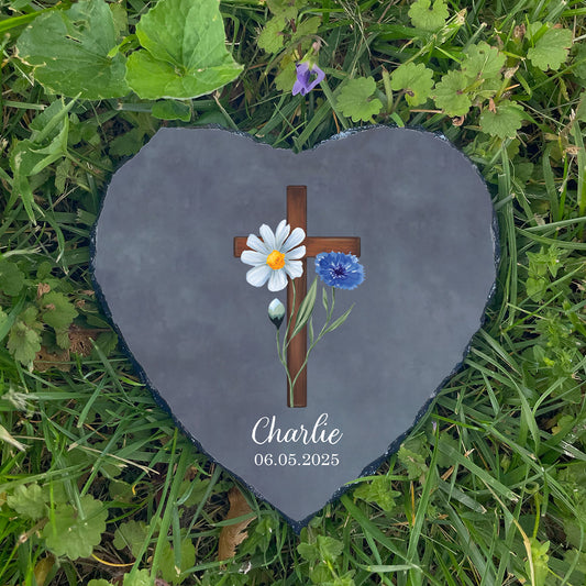 Personalized cross memorial garden stone on grass. Customized with name Charlie. Hopeful Christian sympathy gift